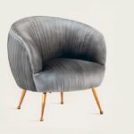 Upholstered armchair with fabric covering